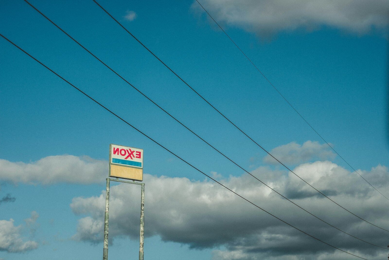 red and white stop sign under blue sky during daytime