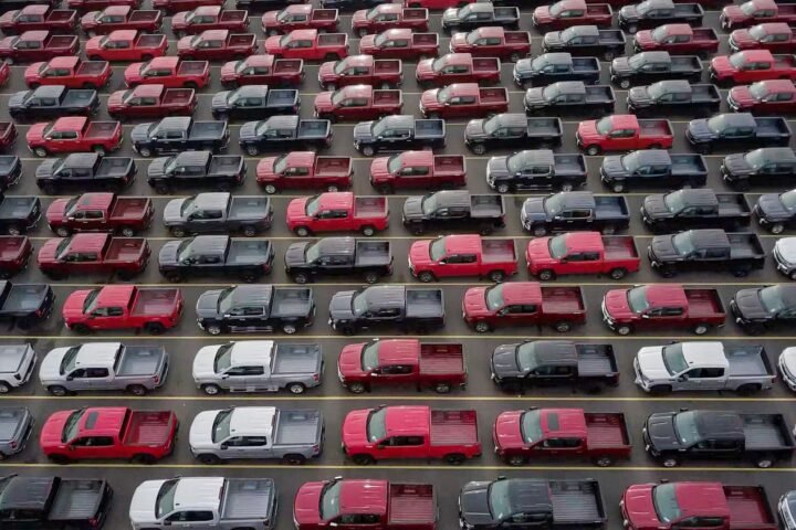 red and black cars on parking lot during daytime