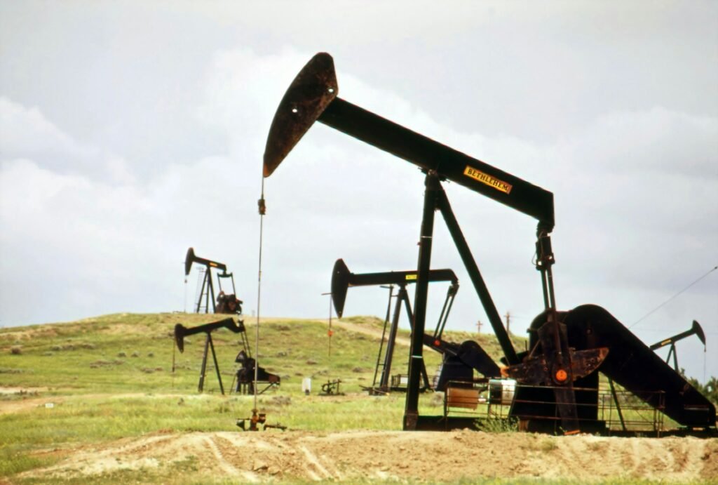 a group of oil pumps sitting on top of a field