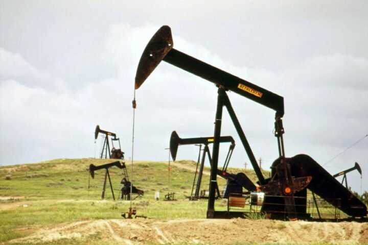 a group of oil pumps sitting on top of a field