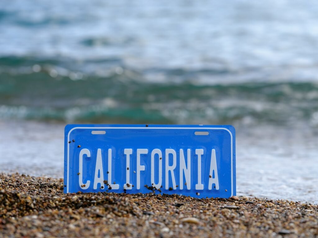 a blue sign on a beach