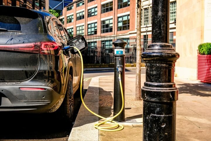 an electric car plugged in to a charging station