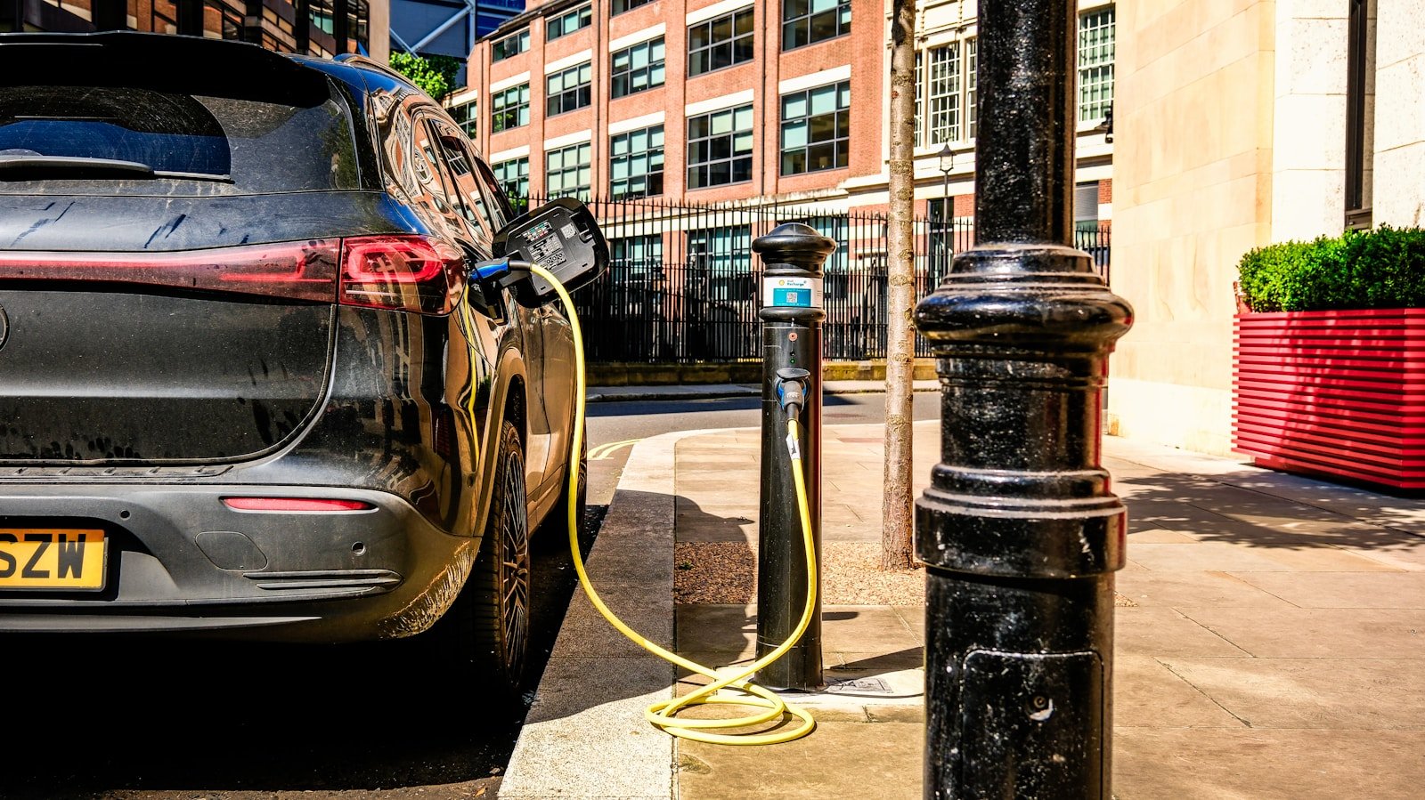 an electric car plugged in to a charging station